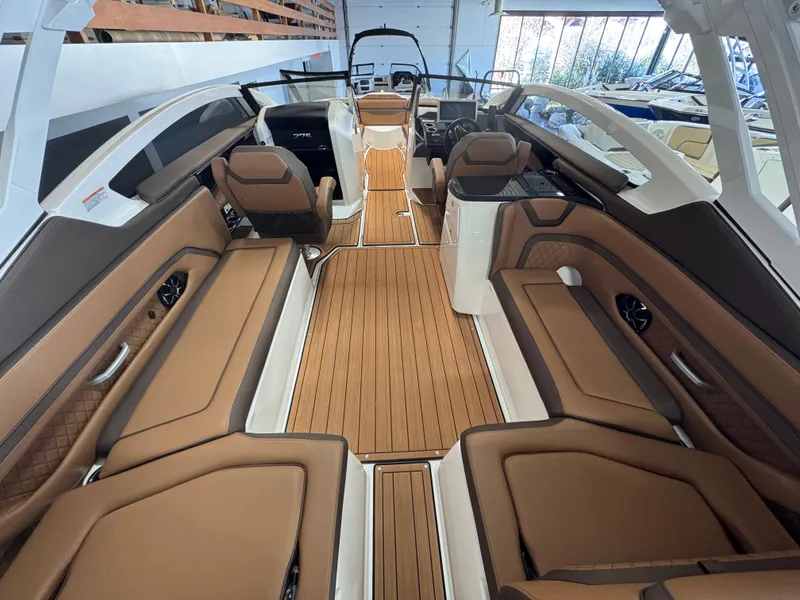 Slide: The Image of 2024 Yamaha Boats 275 SD interior with luxurious seating and sleek design. - 3