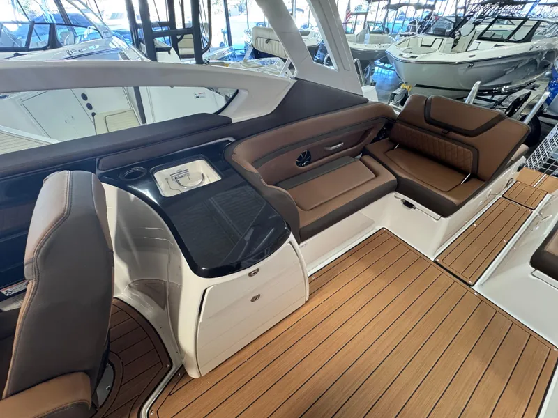 Slide: The Image of 2024 Yamaha Boats 275 SD interior with sleek seating and modern design. - 5