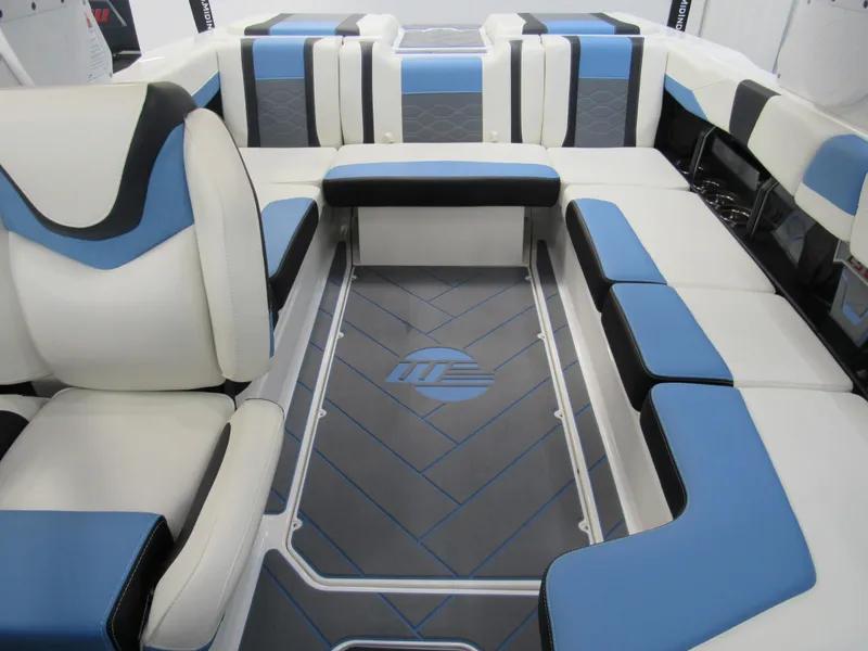 Slide: The Image of 2024 Malibu 23 LSV interior with blue and white seating, modern design. - 12