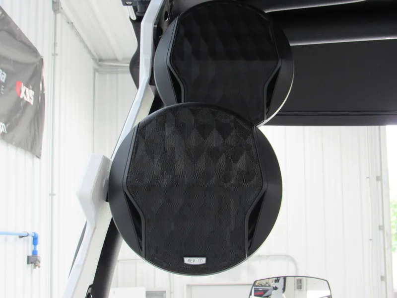 Slide: The Image of 2024 Malibu 23 LSV boat speakers in a garage setting. - 17