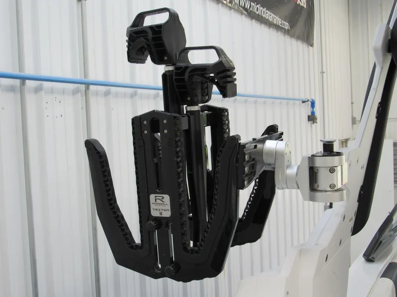 Slide: The Image of 2024 Malibu 23 LSV wakeboard rack in a boat storage facility. - 18