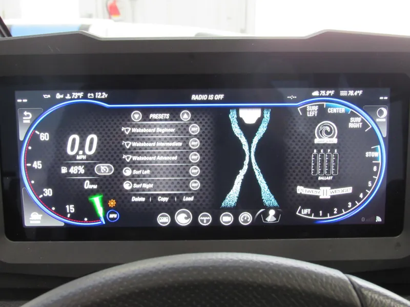 Slide: The Image of 2024 Malibu 23 LSV dashboard display with speedometer and control settings. - 26