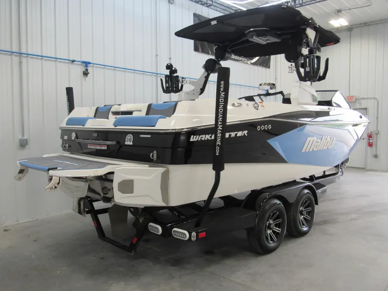 Slide: The Image of 2024 Malibu 23 LSV boat on trailer in indoor storage facility. - 4
