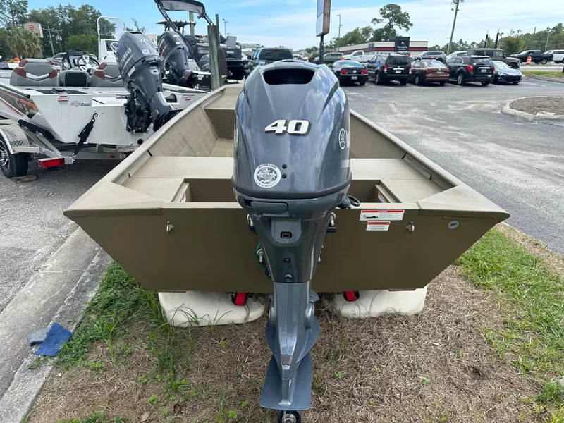 Slide: The Image of 2023 G3 1652 VBW boat with a 40 HP outboard motor in a dealership lot. - 4