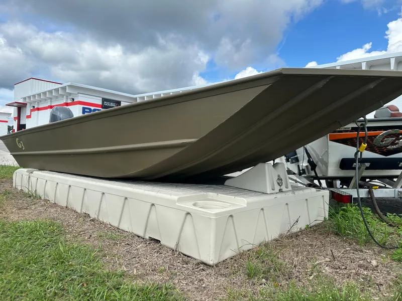 Slide: The Image of 2023 G3 1652 VBW boat on a dock, side view under cloudy sky. - 9