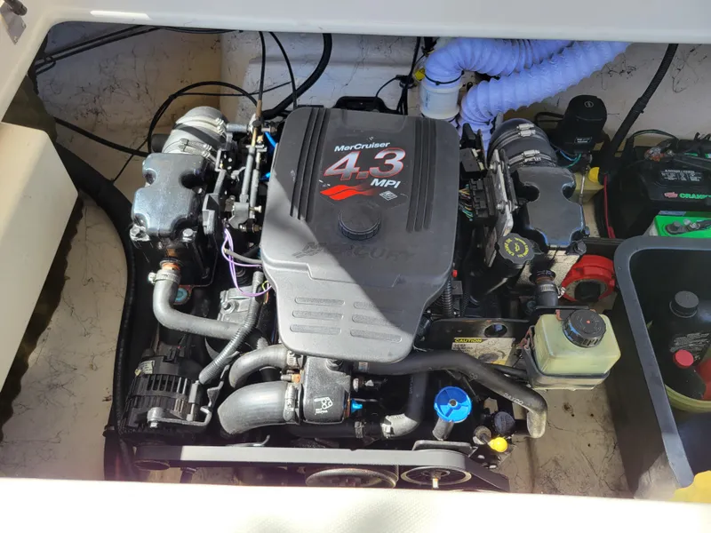 Slide: The Image of 2002 Rinker 212 BR boat engine compartment with MerCruiser 4.3 MPI engine. - 15