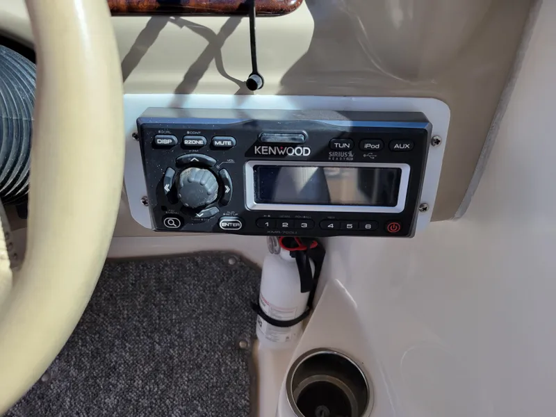 Slide: The Image of Kenwood stereo system in a 2002 Rinker 212 BR boat cockpit. - 21