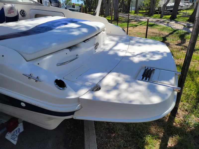 Slide: The Image of 2002 Rinker 212 BR boat stern with swim platform and ladder. - 3