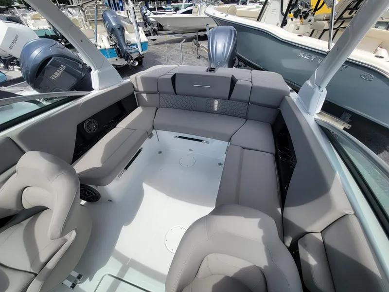 Slide: The Image of 2024 Four Winns H4 OB boat interior with spacious seating and modern design. - 11