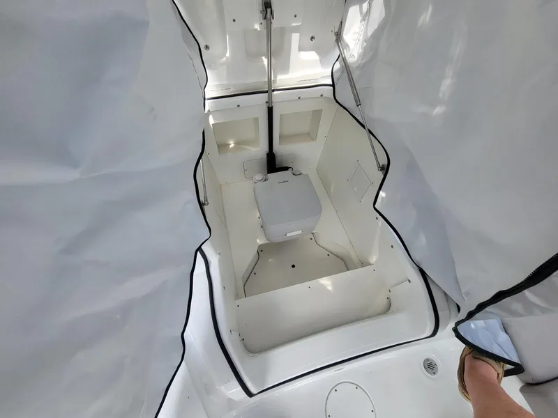 Slide: The Image of 2024 Four Winns H4 OB boat interior with enclosed head compartment. - 20