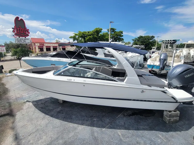Slide: The Image of 2024 Four Winns H4 OB boat with Yamaha outboard motor on display. - 3