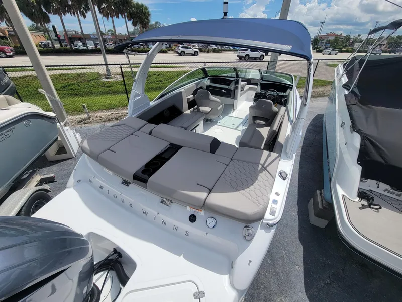 Slide: The Image of 2024 Four Winns H4 OB boat with spacious seating and modern design. - 6