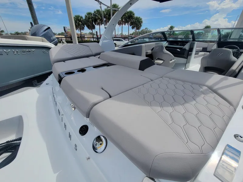 Slide: The Image of 2024 Four Winns H4 OB boat with luxurious seating and modern design. - 7