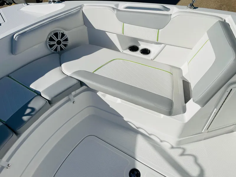 Slide: The Image of 2024 Tahoe 2150 CC boat interior with white and gray seating. - 11