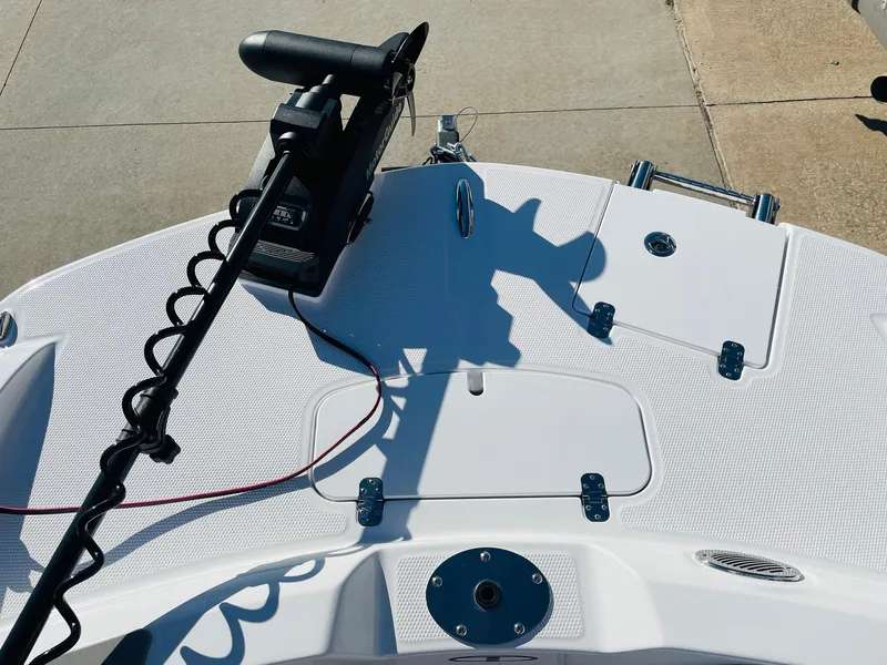 Slide: The Image of 2024 Tahoe 2150 CC boat deck with trolling motor and storage compartments. - 16