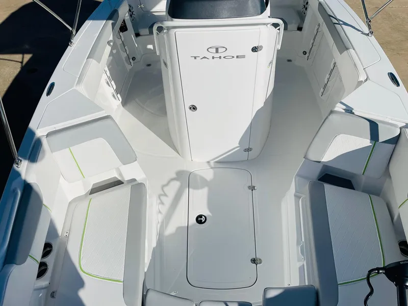 Slide: The Image of 2024 Tahoe 2150 CC boat interior with seating and storage compartments. - 18