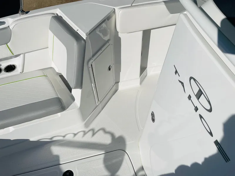 Slide: The Image of 2024 Tahoe 2150 CC boat interior with white and gray seating. - 20
