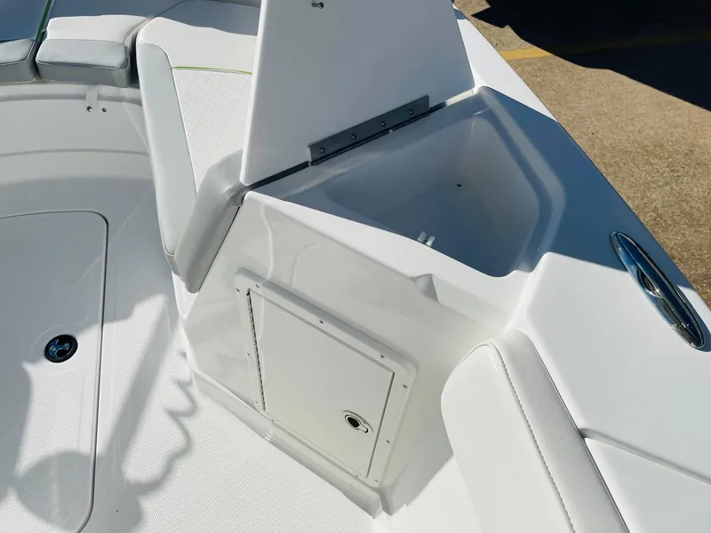 Slide: The Image of 2024 Tahoe 2150 CC boat interior storage compartment and seating. - 21