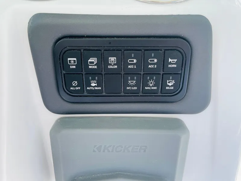 Slide: The Image of Control panel of 2024 Tahoe 2150 CC boat with various function buttons. - 27