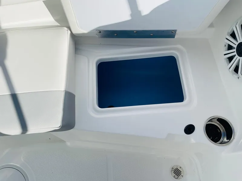 Slide: The Image of 2024 Tahoe 2150 CC boat interior storage compartment and seating. - 37
