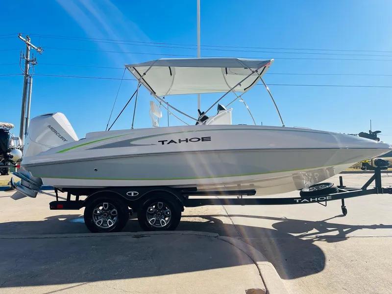 Slide: The Image of 2024 Tahoe 2150 CC boat on trailer with canopy, side view. - 4