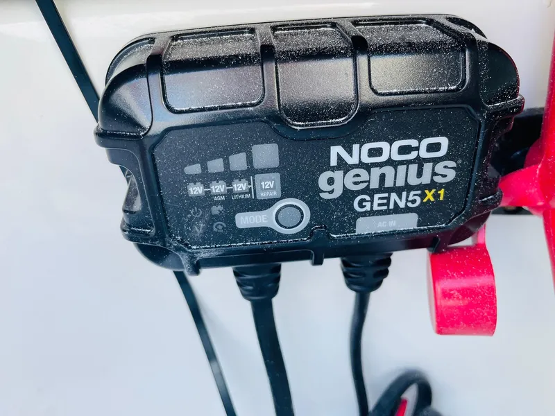Slide: The Image of NOCO Genius GEN5X1 battery charger on a 2024 Tahoe 2150 CC boat. - 40