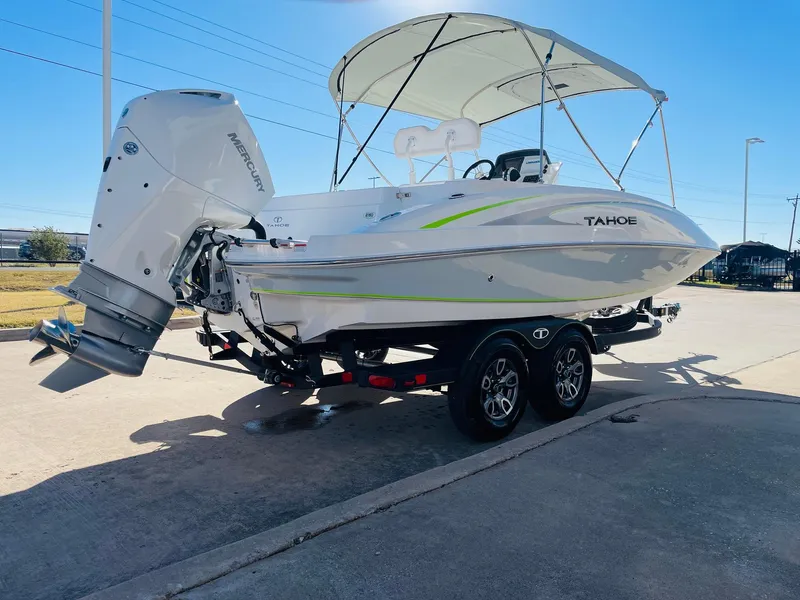 Slide: The Image of 2024 Tahoe 2150 CC boat with Mercury outboard engine on a trailer. - 5