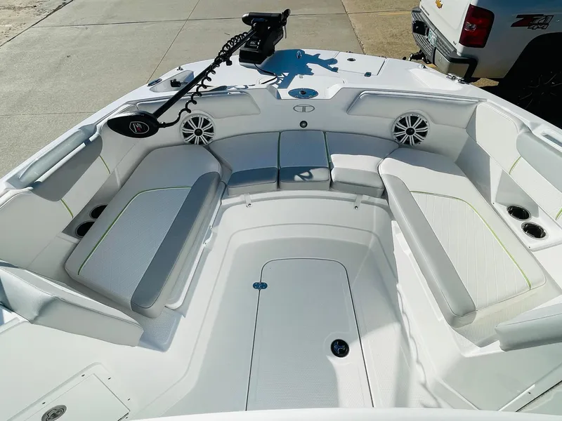 Slide: The Image of 2024 Tahoe 2150 CC boat interior with white seating and modern design. - 8