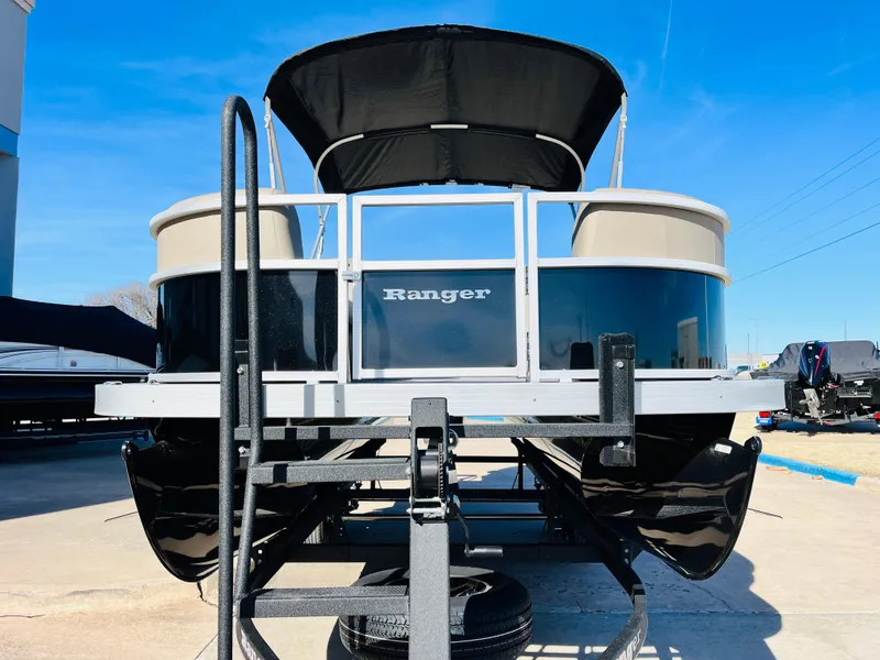 Slide: The Image of 2024 Ranger Reata 200C pontoon boat on trailer, front view. - 3