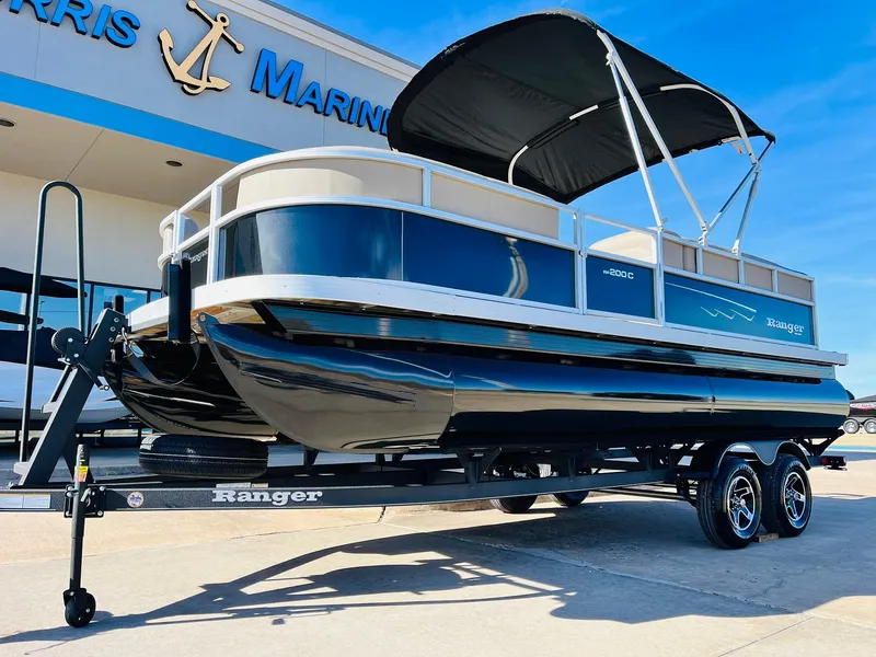 Slide: The Image of 2024 Ranger Reata 200C pontoon boat on trailer at Harris Marine. - 31
