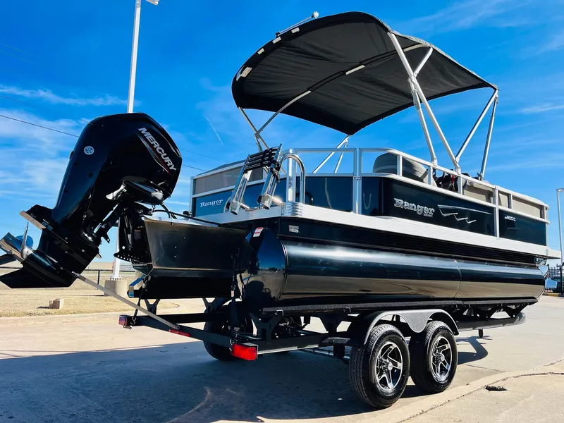 Slide: The Image of 2024 Ranger Reata 200C pontoon boat with Mercury outboard motor on trailer. - 35