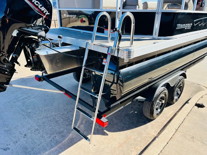 Slide: The Image of 2024 Ranger Reata 200C boat with ladder and Mercury outboard motor. - 38