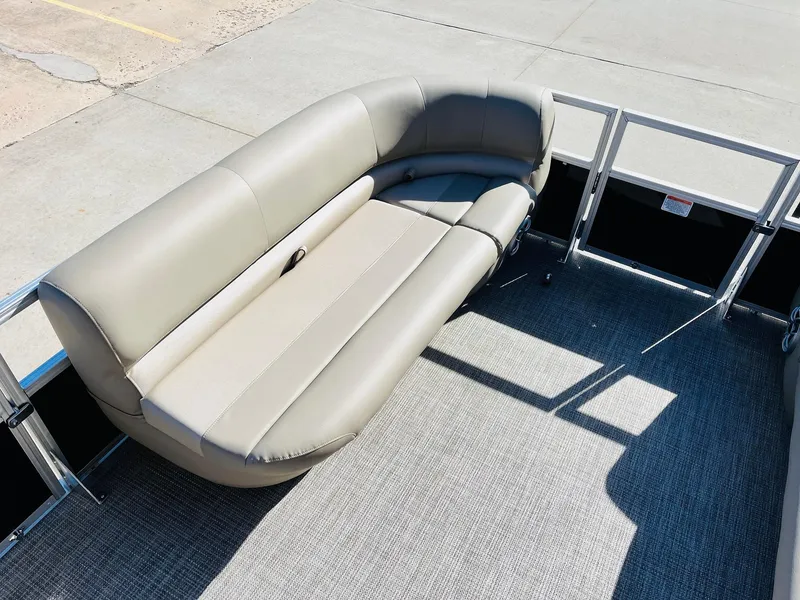 Slide: The Image of 2024 Ranger Reata 200C pontoon boat with beige seating and gray flooring. - 40