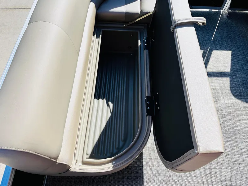 Slide: The Image of 2024 Ranger Reata 200C boat seat storage compartment open. - 42