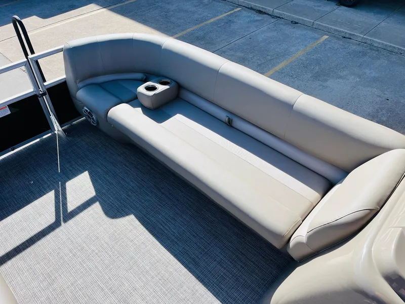 Slide: The Image of 2024 Ranger Reata 200C pontoon boat with spacious seating and cup holders. - 46