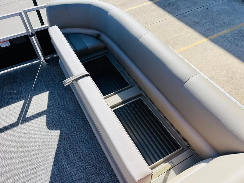 Slide: The Image of 2024 Ranger Reata 200C boat with spacious seating and storage compartments. - 48