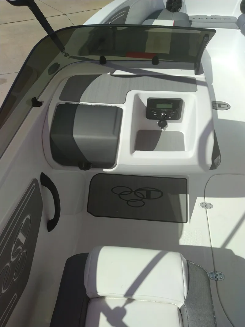 Slide: The Image of 2024 Tahoe T21 boat interior with dashboard and seating. - 4