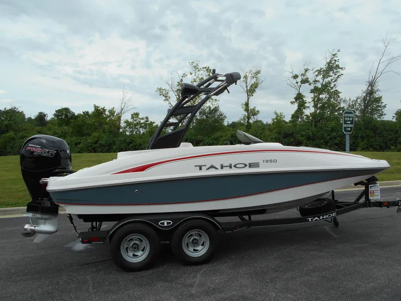 The Image of 2024 Tahoe 1950 boat on trailer, side view, outdoors. - 0