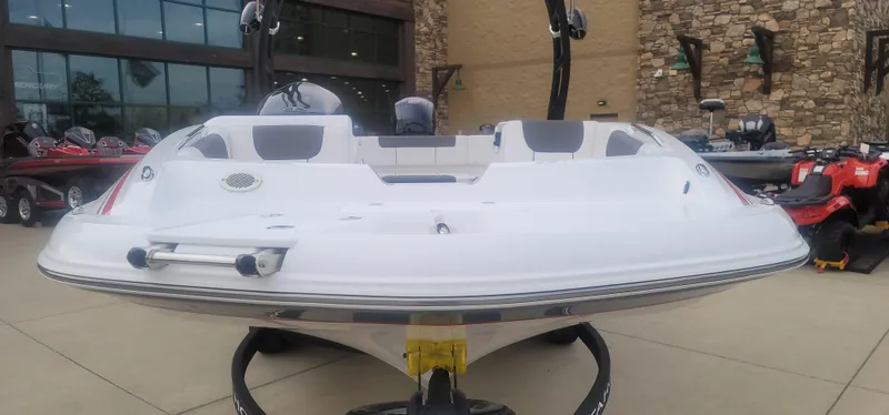 Slide: The Image of 2024 Tahoe 1950 boat displayed outdoors, front view. - 4