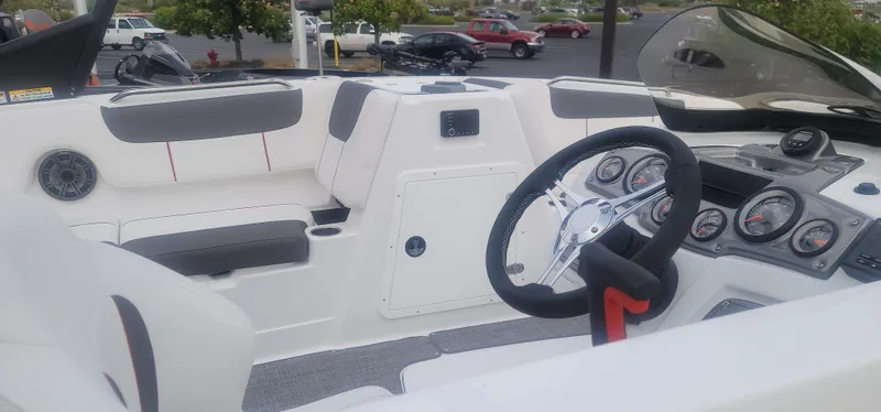 Slide: The Image of 2024 Tahoe 1950 boat interior with steering wheel and dashboard. - 5