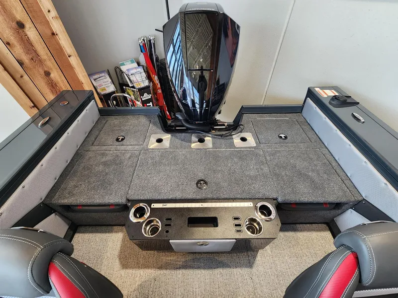 Slide: The Image of 2024 Ranger VX1888 WT boat interior with motor, featuring seating and storage compartments. - 3