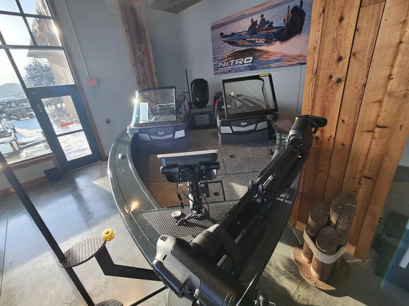 Slide: The Image of 2024 Ranger VX1888 WT boat displayed indoors with fishing equipment. - 4