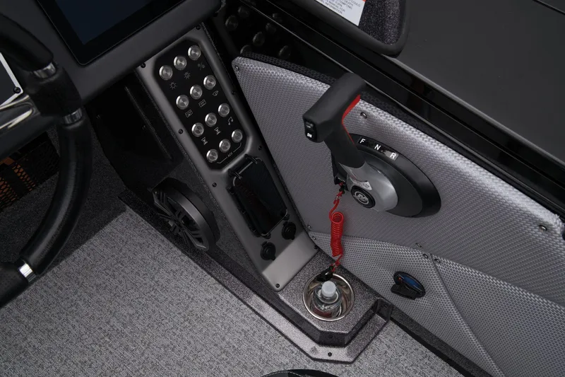Slide: The Image of 2024 Ranger VX1888 WT boat control panel and throttle lever. - 56