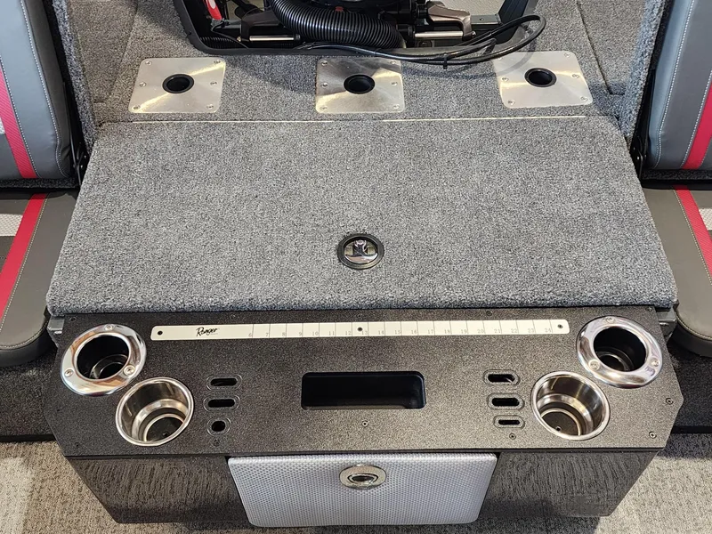 Slide: The Image of 2024 Ranger VX1888 WT boat interior with cup holders and storage compartments. - 7