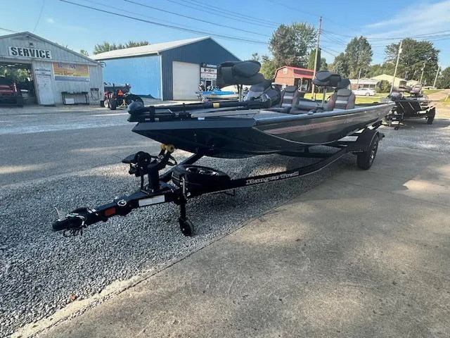 Slide: The Image of 2024 Ranger RT178 boat on trailer in outdoor service area. - 11