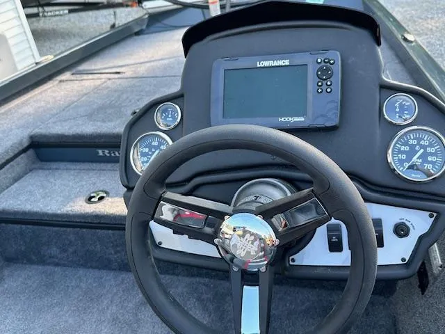 Slide: The Image of 2024 Ranger RT178 boat dashboard with steering wheel and Lowrance fishfinder. - 6