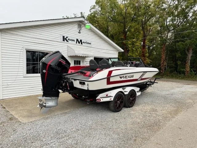 Slide: The Image of 2024 Vexus DVX20S boat on trailer outside Knox Marine building. - 3