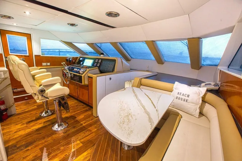 Slide: The Image of Interior of 1998 Cheoy Lee 81 Motor Yacht with helm station and seating area. - 11