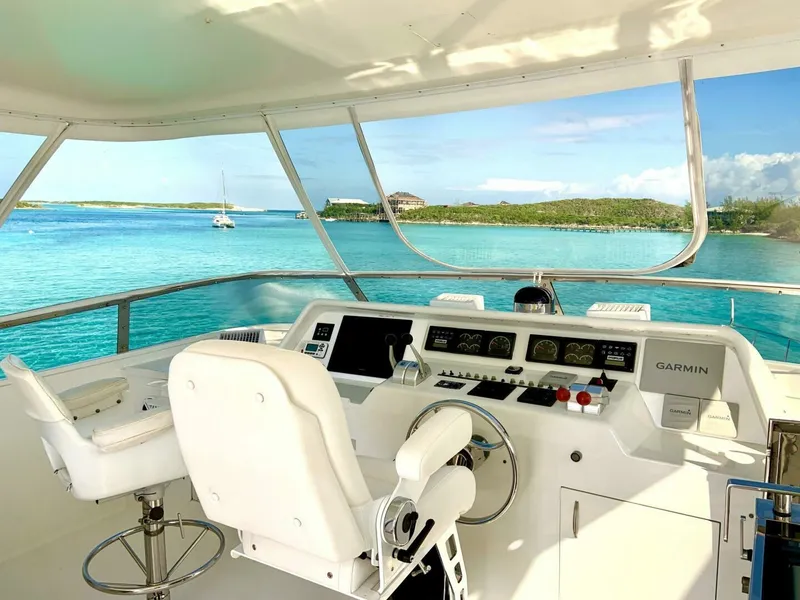 Slide: The Image of 1998 Cheoy Lee 81 Motor Yacht helm with ocean view and modern navigation equipment. - 13