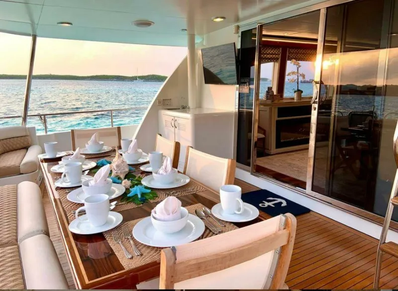 Slide: The Image of Luxurious dining area on 1998 Cheoy Lee 81 Motor Yacht with ocean view. - 3